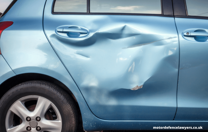 Damage to rear door of car