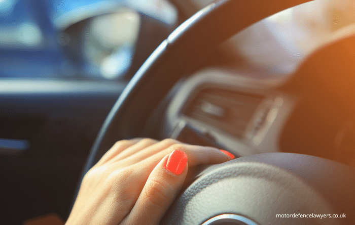 hand on steering wheel 